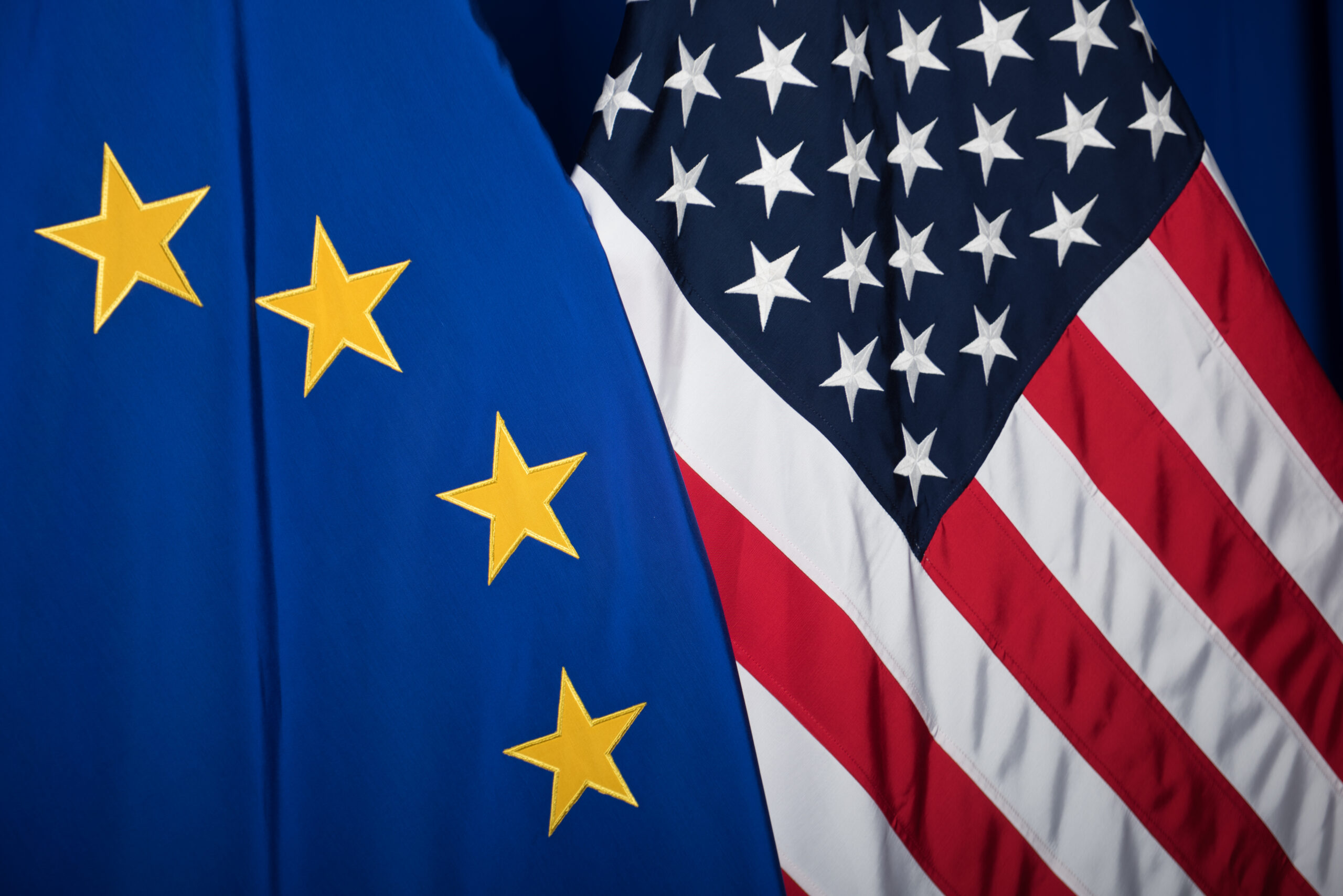 The national flag of the United States next to the European flag